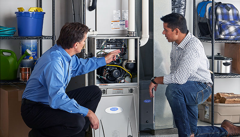 Technician evaluating a furnace for repair or replacement in Baldwin Park