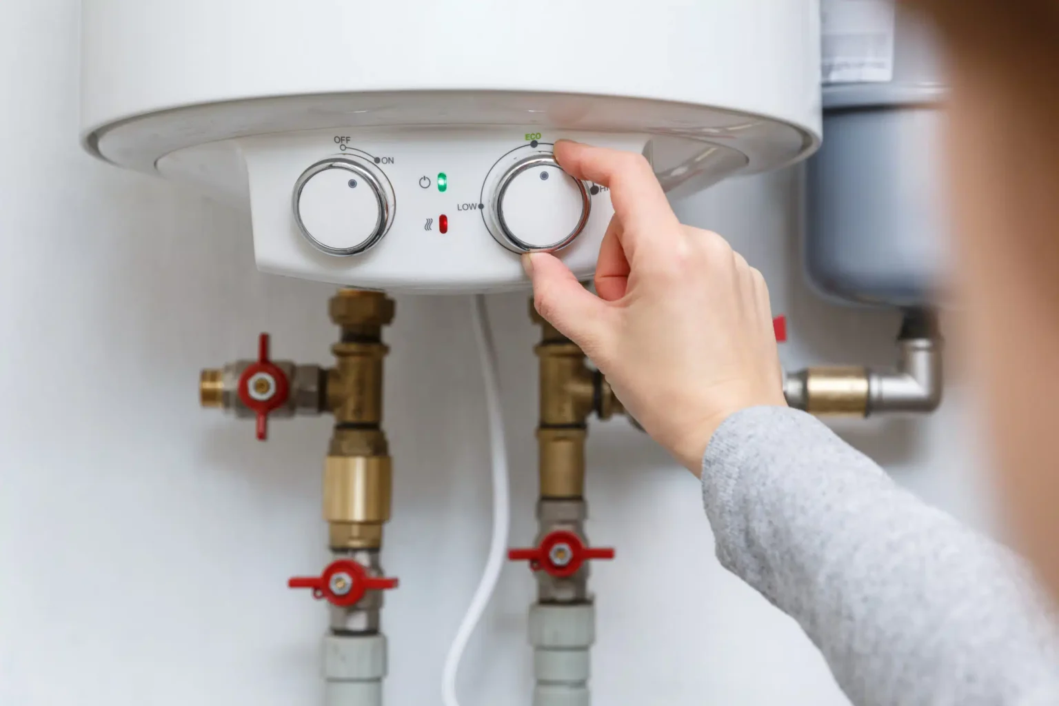 Technician adjusting a water heater in Baldwin Park